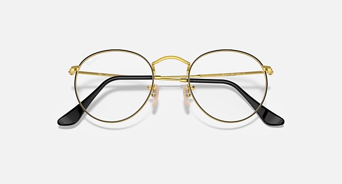 ROUND METAL OPTICS メガネ ゴールド上にブラック と クリア (50-21
